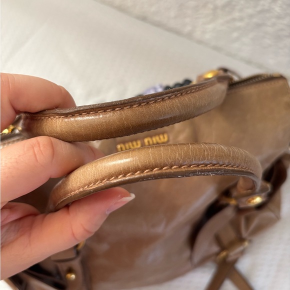 Miu miu Mini Bow Bag in a tan color. - Picture 13 of 14